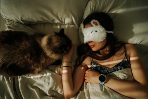 Why does my cat sleep with me and not my husband?